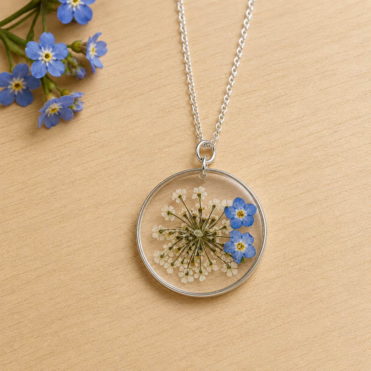 Forget-me-not circle resin necklace in silver