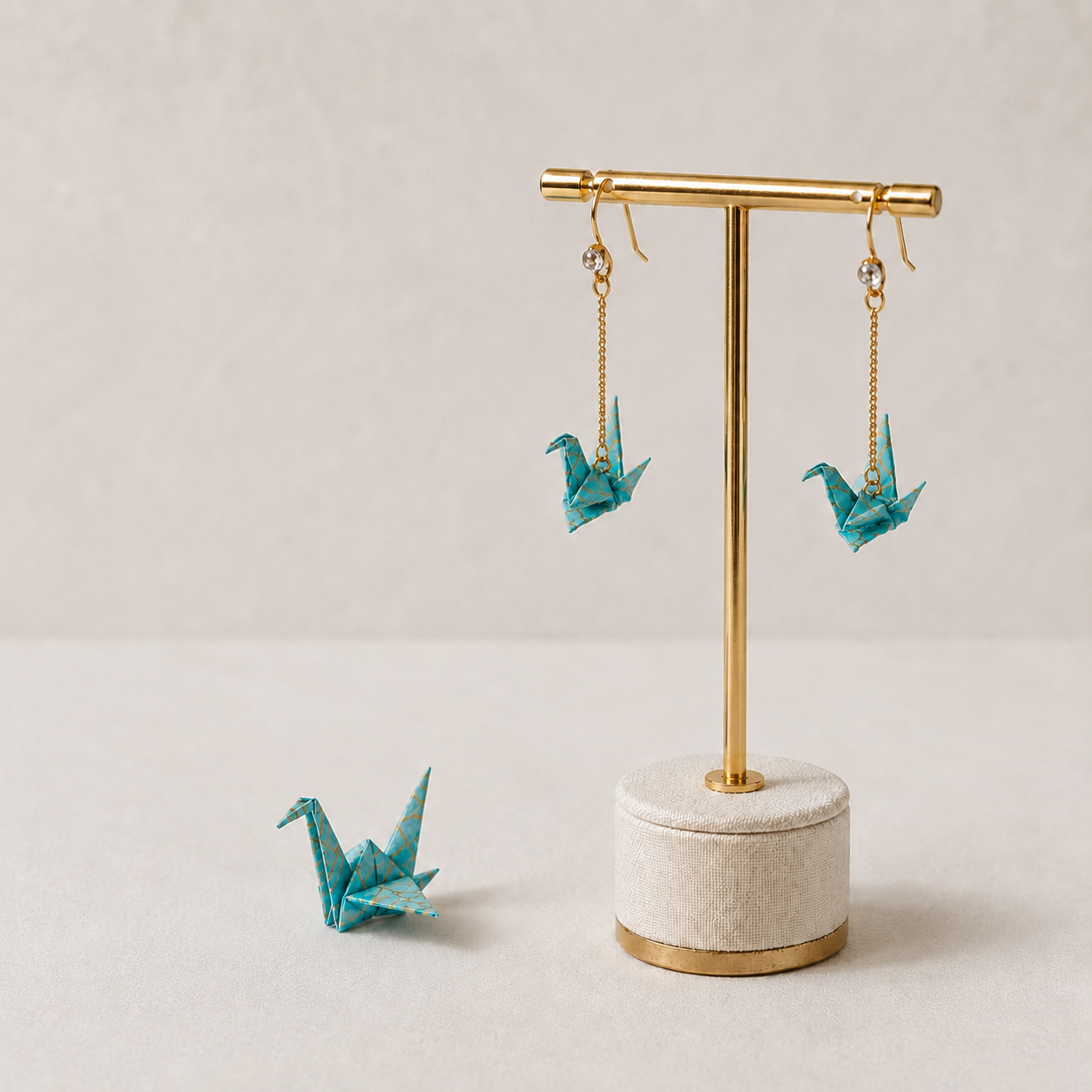 Miniature blue origami crane earrings folded from real paper