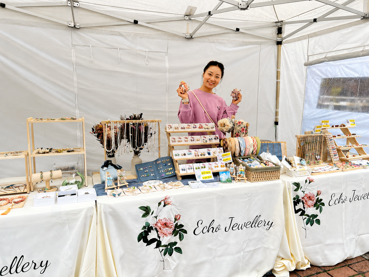 Echo Jewellery founder Yi Zou at a market stall displaying the jewellery collection