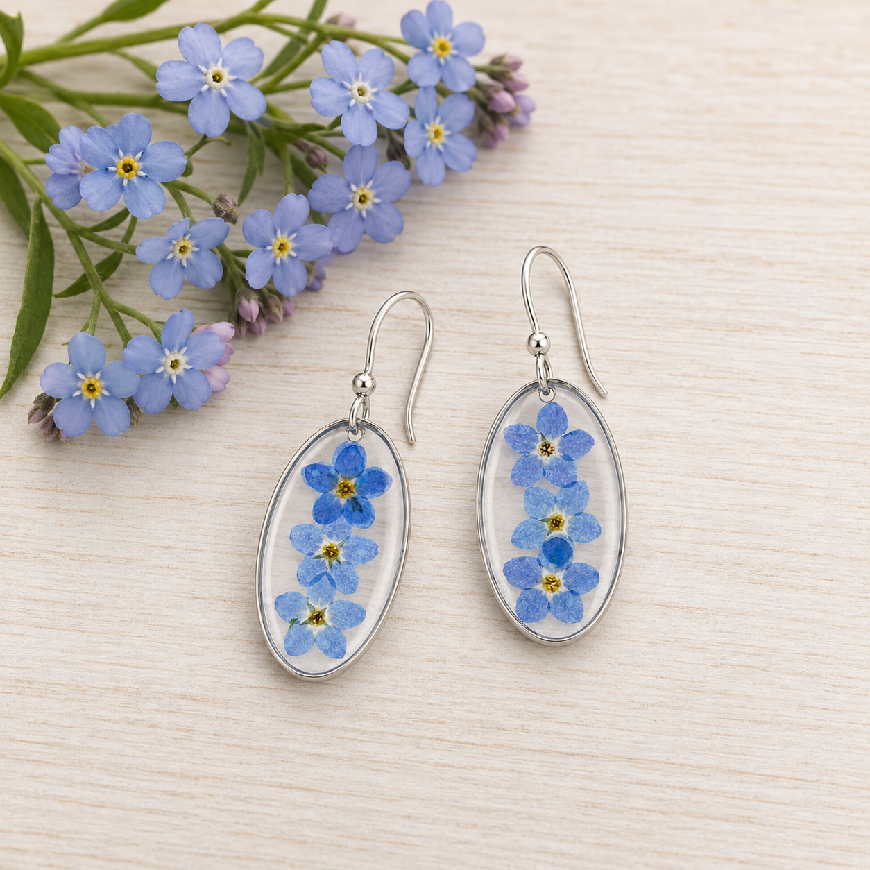 Forget-me-not oval resin earrings in silver